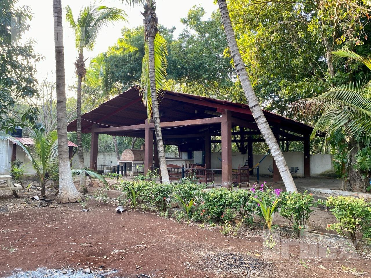 VENDO BONITO TERRENO CON ALBERCA, TOTALMENTE BARDEADO, PALAPA, ÁRBOLES FRUTALES EN IMI III, CAMPECHE.